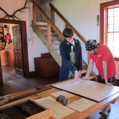 Examing a Map at Grand Portage
